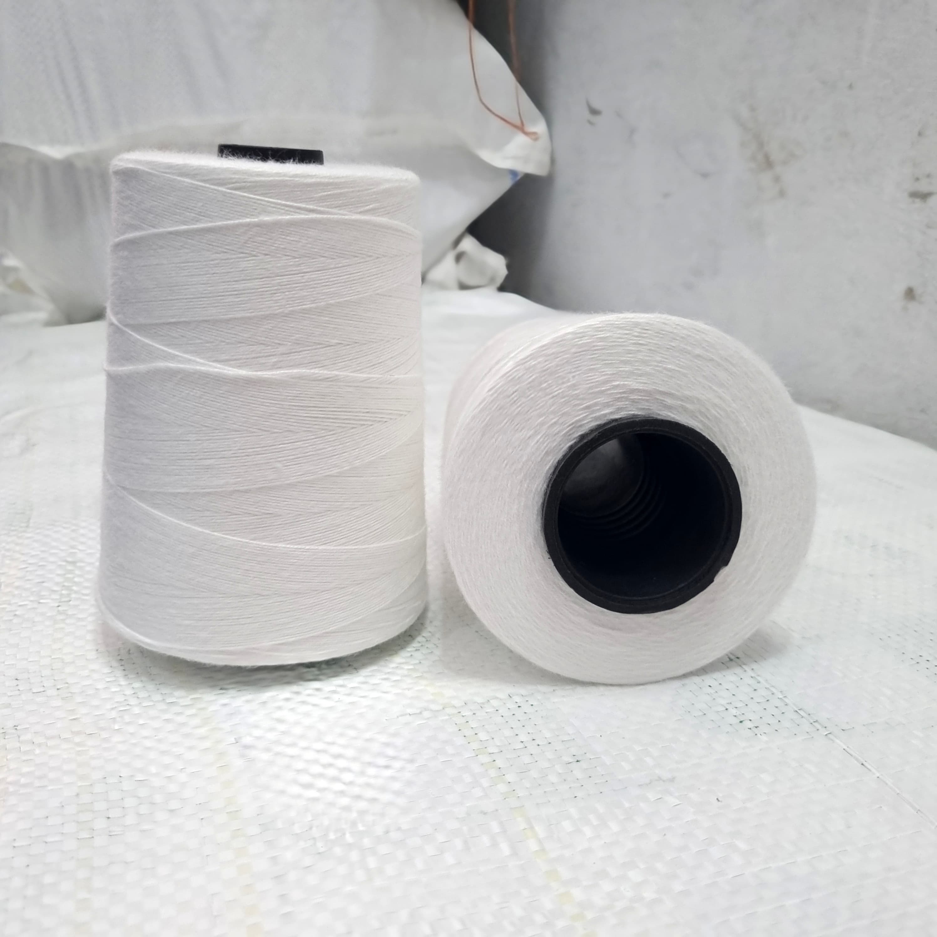 White 3-ply recycled polyester yarn spools, 12 count